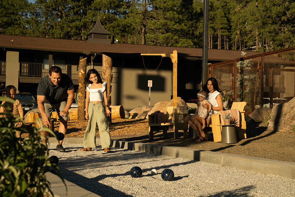 Family playing bocce ball