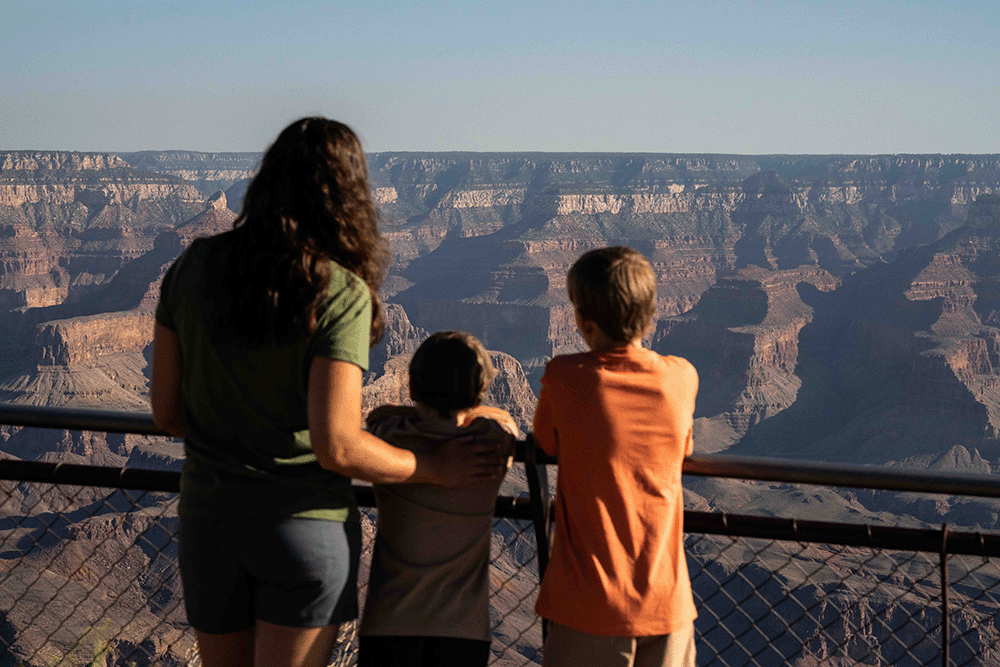 Family look at grand canyon