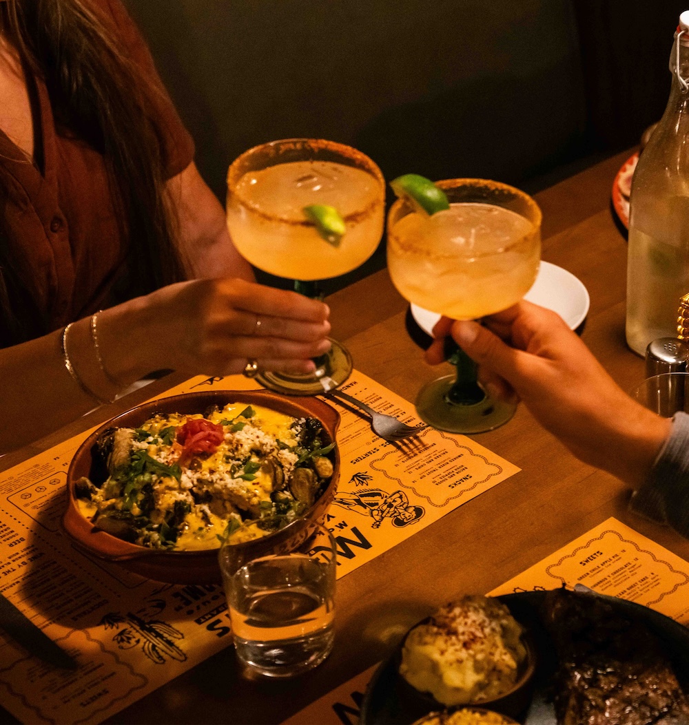 toasting glasses at dinner