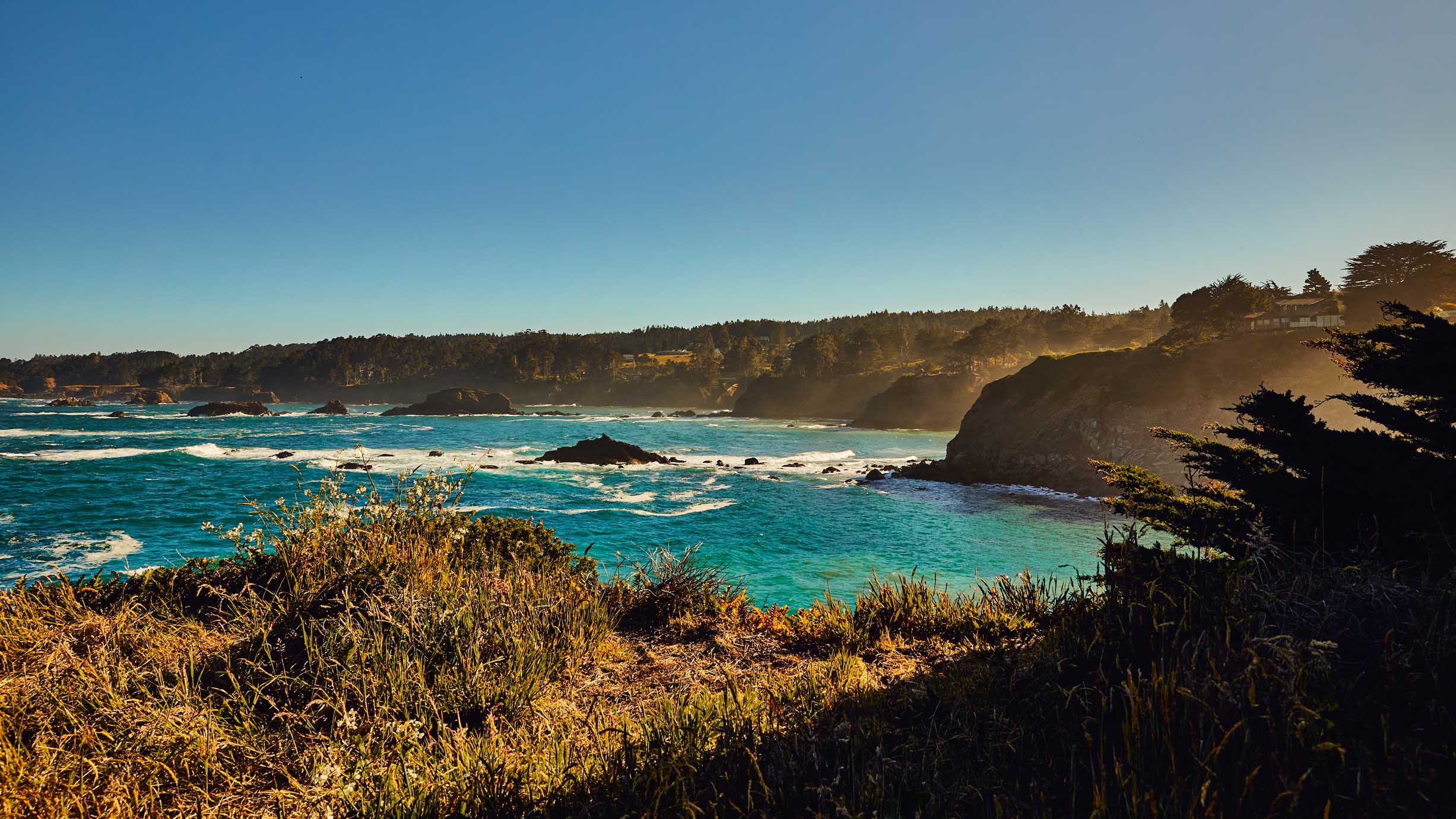 Mendocino coast with bright blue waters and cliff edges