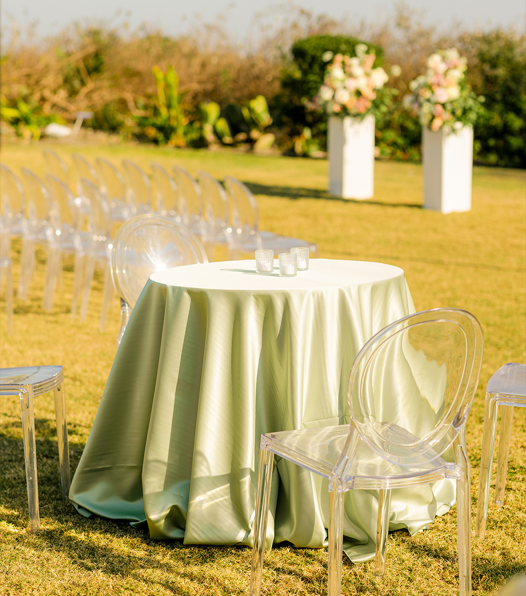 outside gardens and lawn setup for a beachside wedding ceremony