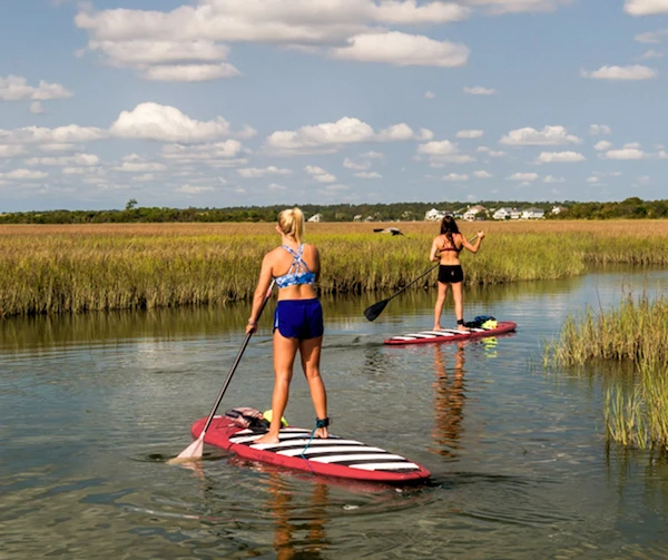 Two girls in a standup paddle